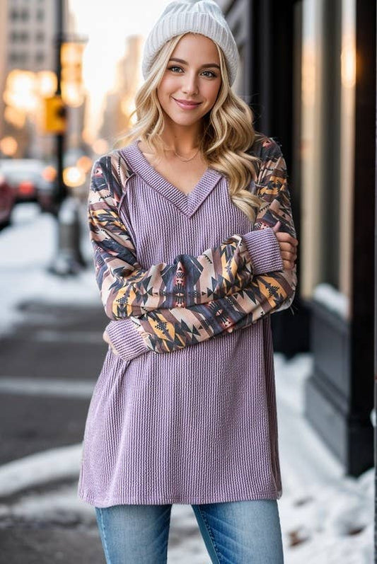 PURPLE RIBBED TOP WITH AZTEC SLEEVES.