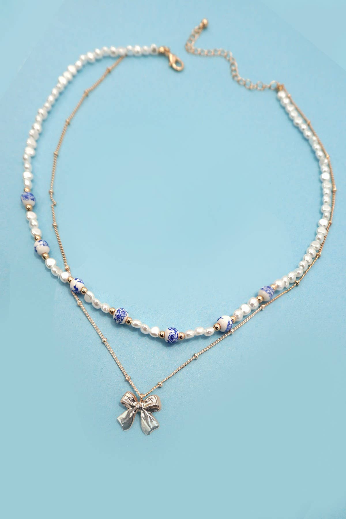 CERAMIC PORCELAIN PEARL BOW LAYER NECKLACE |